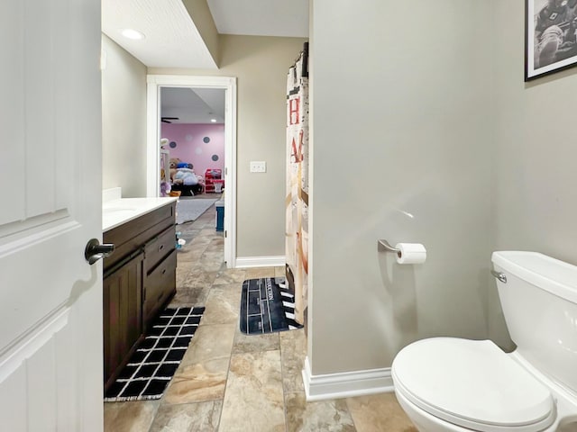 bathroom featuring vanity and toilet