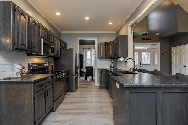 kitchen featuring black electric range oven, sink, dark brown cabinetry, ornamental molding, and kitchen peninsula