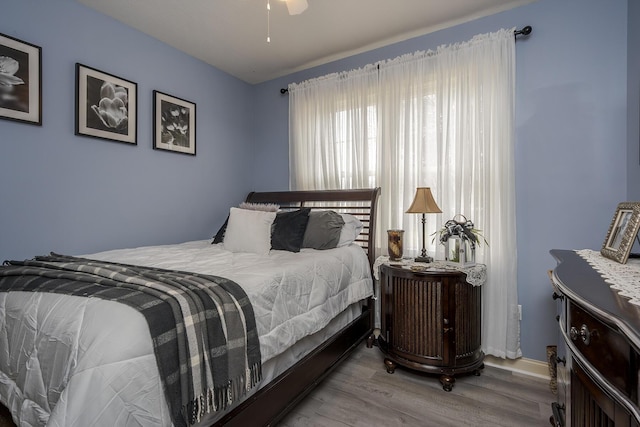 bedroom with wood-type flooring