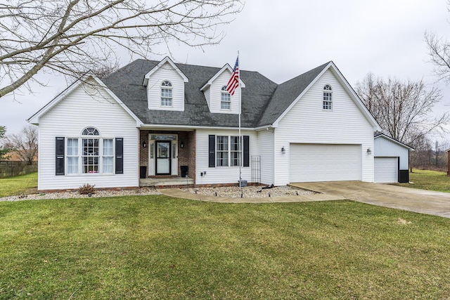 new england style home with a garage and a front yard