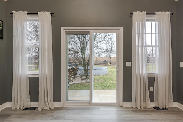 entryway with light hardwood / wood-style flooring