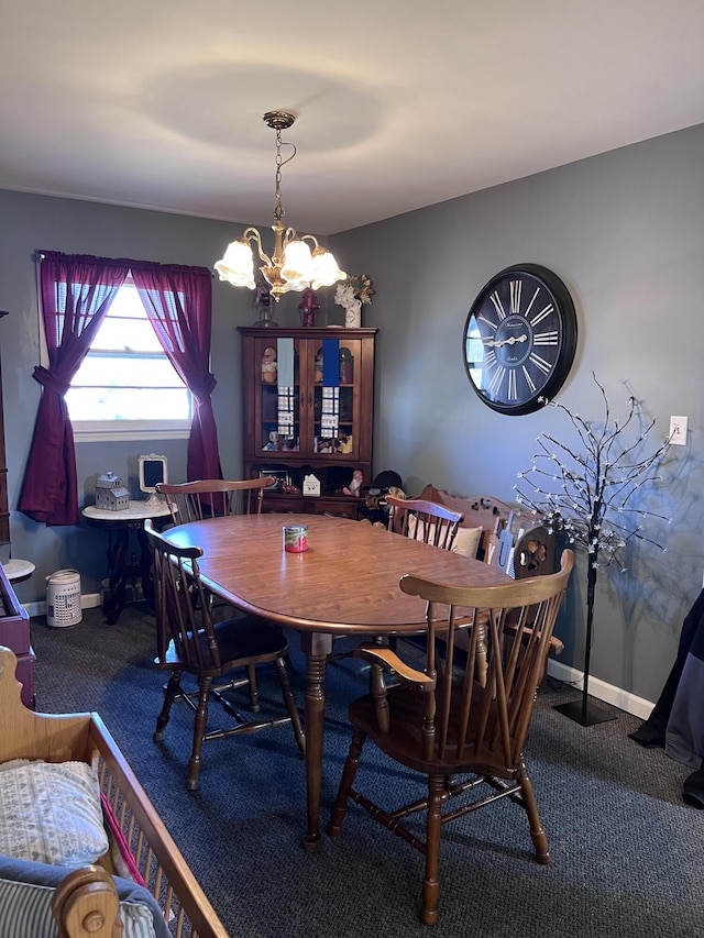 dining space featuring carpet and a notable chandelier