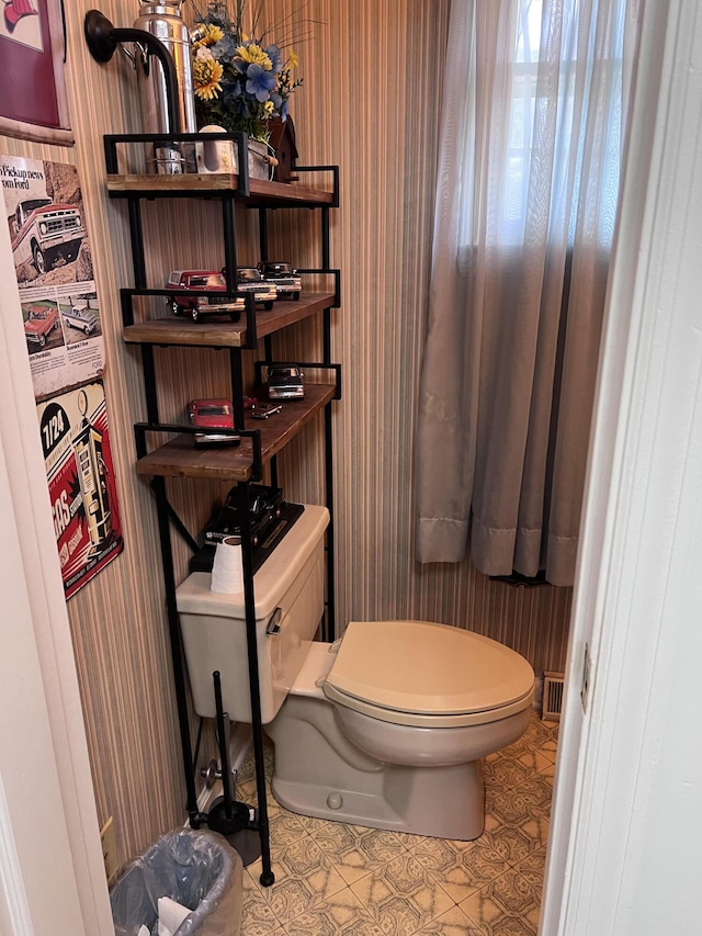 bathroom featuring tile patterned floors and toilet