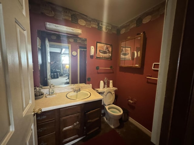 bathroom with vanity and toilet