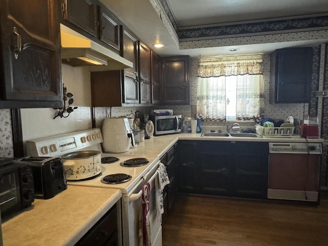 kitchen with dishwashing machine, sink, crown molding, electric range, and dark brown cabinets