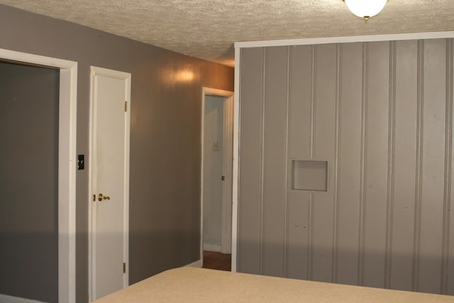 unfurnished bedroom with a textured ceiling