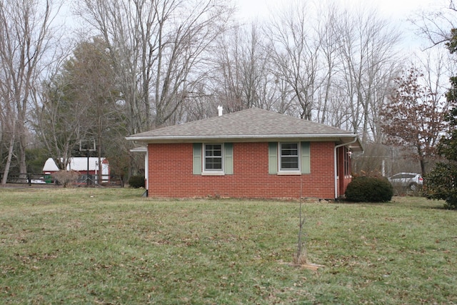 view of home's exterior featuring a lawn