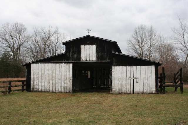 view of outbuilding featuring a yard