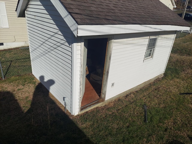 view of side of property featuring a yard