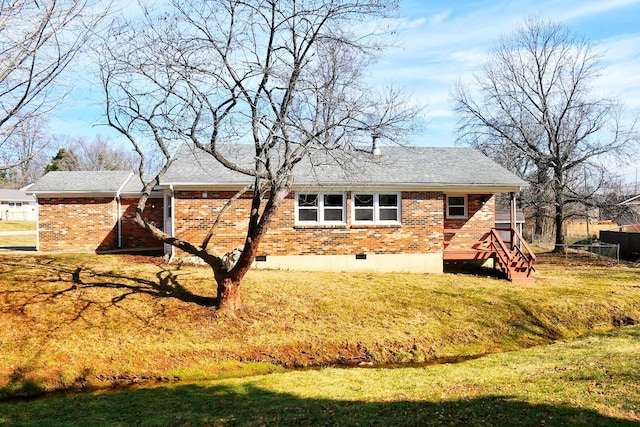 rear view of house with a lawn