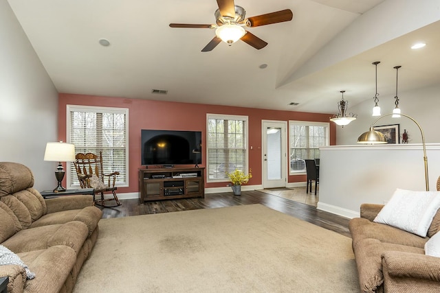 living area featuring recessed lighting, visible vents, baseboards, vaulted ceiling, and dark wood-style floors