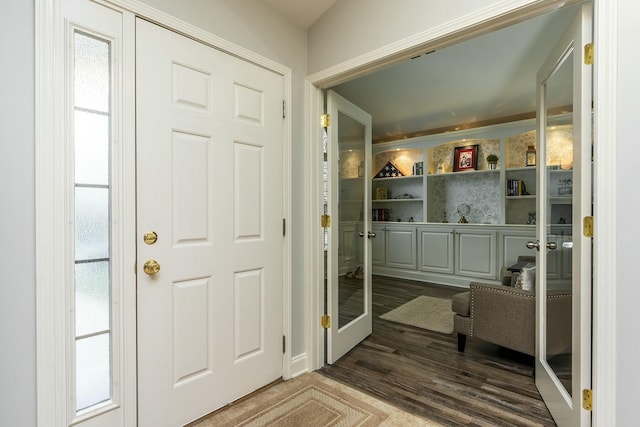 foyer entrance with wood finished floors