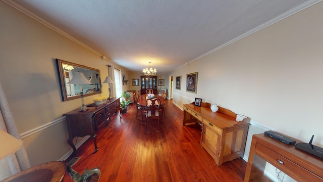 interior space with baseboards, a chandelier, dark wood finished floors, and ornamental molding