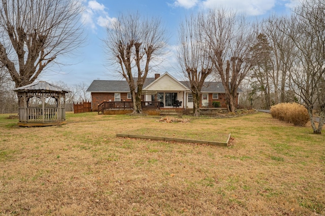 view of yard with a deck and a gazebo