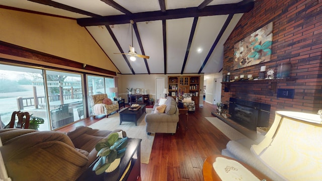 living room featuring high vaulted ceiling, a ceiling fan, a brick fireplace, beam ceiling, and dark wood finished floors