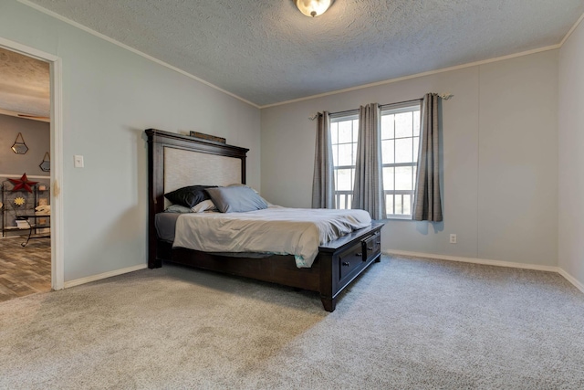 carpeted bedroom featuring crown molding and a textured ceiling