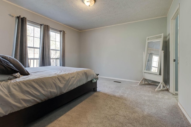 carpeted bedroom featuring multiple windows, crown molding, and a textured ceiling