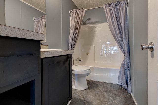 full bathroom featuring vanity, toilet, shower / bathtub combination with curtain, tile patterned floors, and a textured ceiling