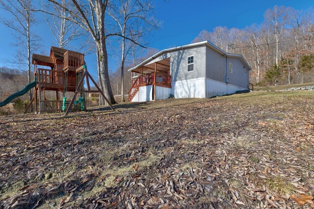 view of home's exterior featuring a playground