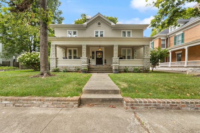 view of front of property featuring a front yard and covered porch