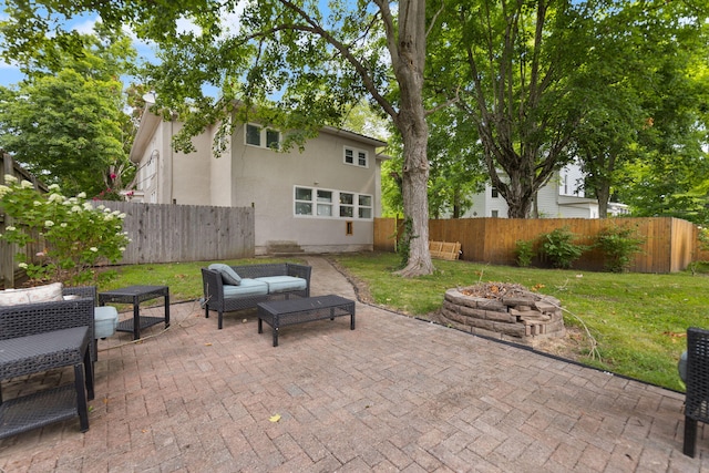 view of patio featuring an outdoor living space with a fire pit