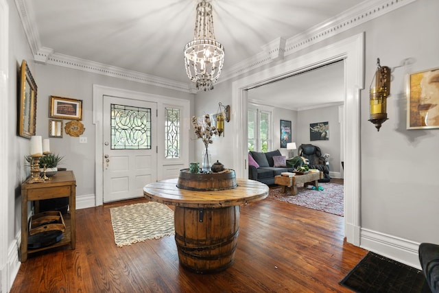 entryway featuring a notable chandelier, ornamental molding, and dark hardwood / wood-style floors