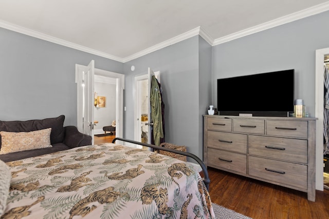 bedroom with ornamental molding and dark hardwood / wood-style flooring