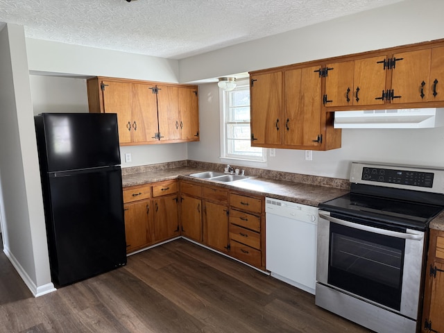 kitchen with sink, black refrigerator, dark hardwood / wood-style floors, white dishwasher, and stainless steel range with electric cooktop