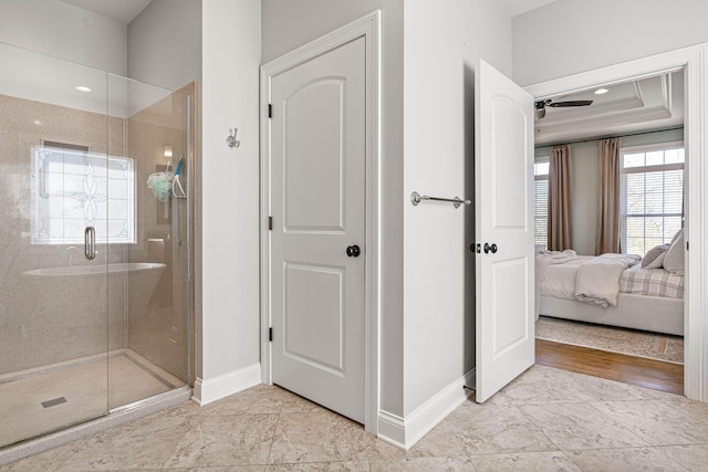 bathroom featuring a shower with door