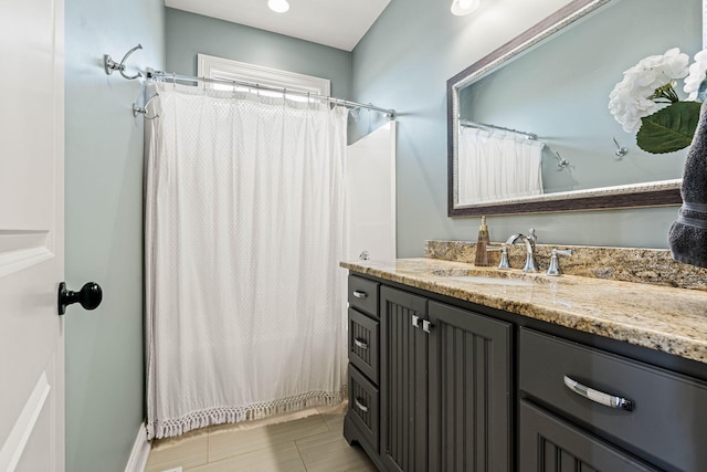 bathroom with vanity and a shower with shower curtain