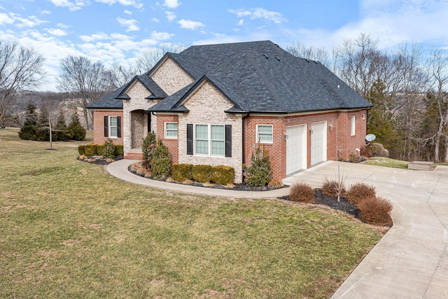 view of front of home with a garage and a front yard