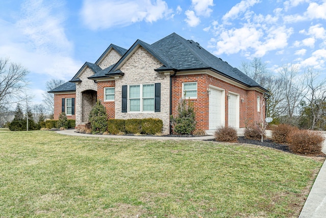 view of front of home with a garage and a front lawn