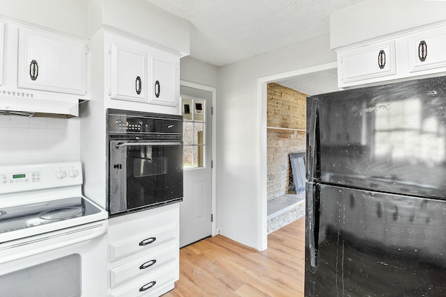 kitchen featuring white cabinetry, tasteful backsplash, black appliances, a textured ceiling, and light wood-type flooring