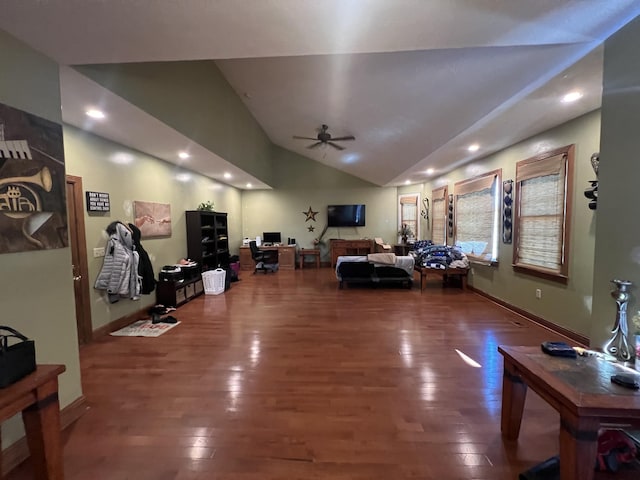 living room with dark wood-type flooring, ceiling fan, and lofted ceiling