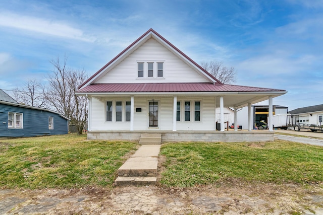 farmhouse inspired home with a porch and a front yard