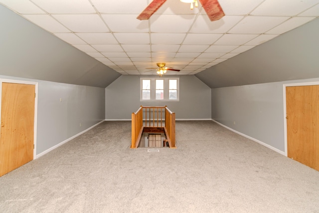 bonus room with vaulted ceiling, ceiling fan, and carpet flooring