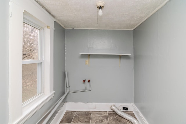 laundry area with washer hookup, hookup for an electric dryer, and a textured ceiling