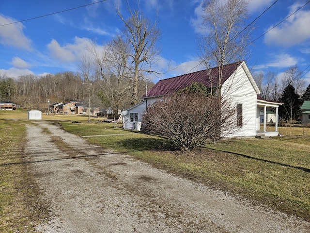 view of property exterior with a lawn