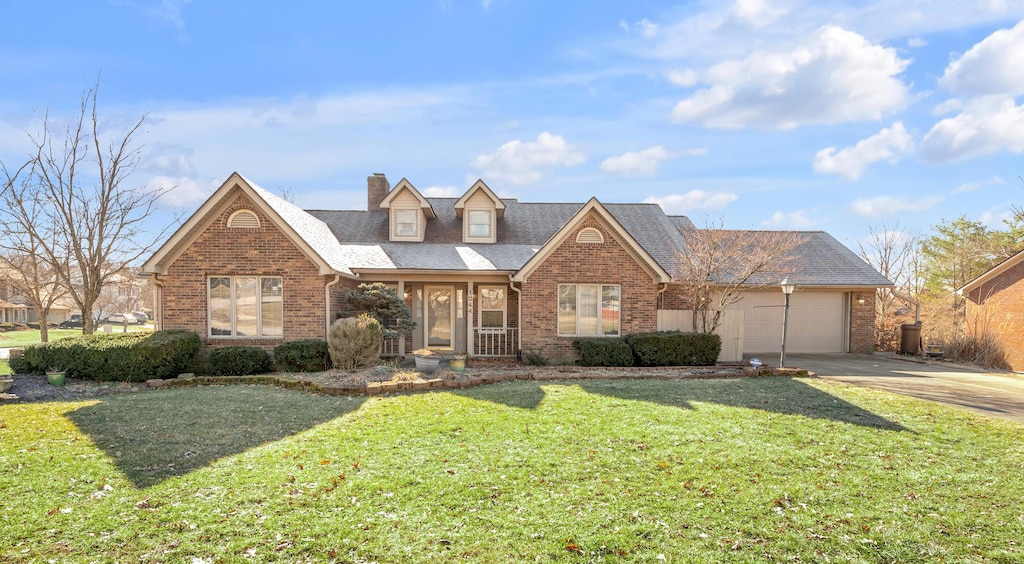 view of front of house featuring a garage and a front yard