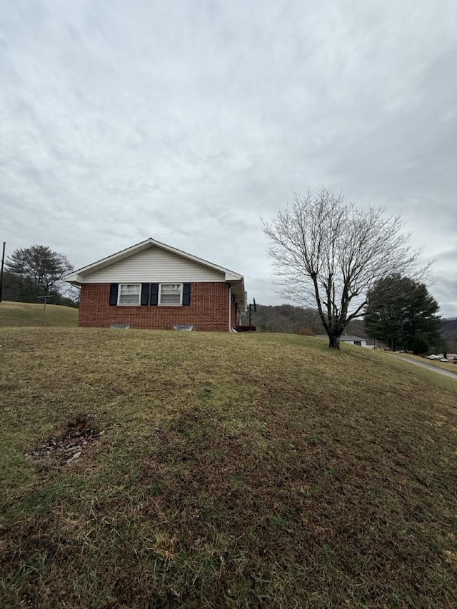 view of property exterior with a yard