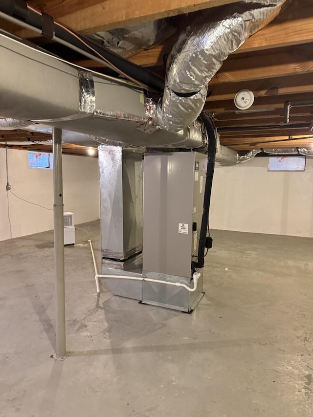 basement featuring heating unit