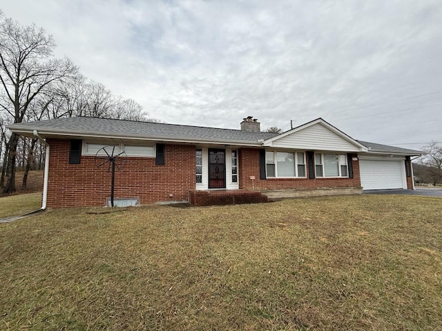 single story home featuring a garage and a front lawn