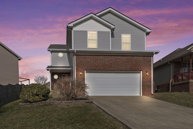 view of property featuring a yard and a garage