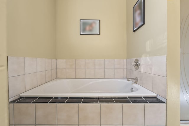 bathroom with tiled bath