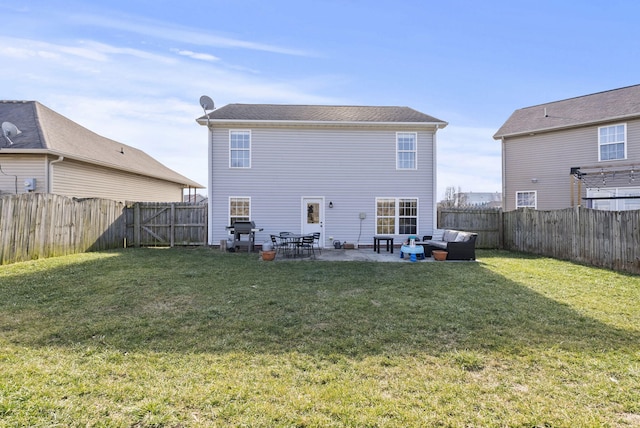 back of property with a patio, a yard, and an outdoor hangout area