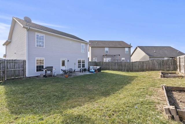 back of property with a lawn and a patio area