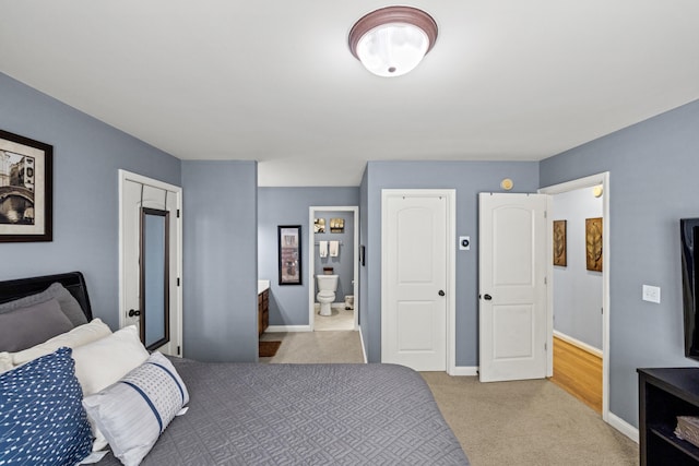 bedroom featuring baseboards and light colored carpet