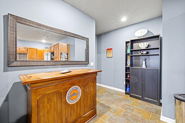 interior space with recessed lighting and baseboards