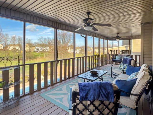 sunroom / solarium with ceiling fan