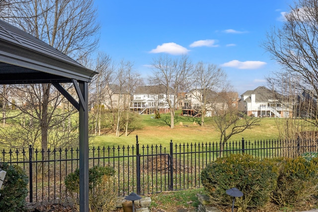 view of yard with a residential view and fence